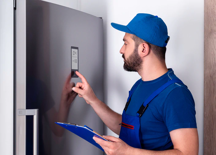 worker diagnosing the commercial refrigerator